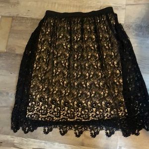 Gorgeous black lace shirt with nude slip.